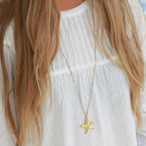 Lange gouden ketting zeester